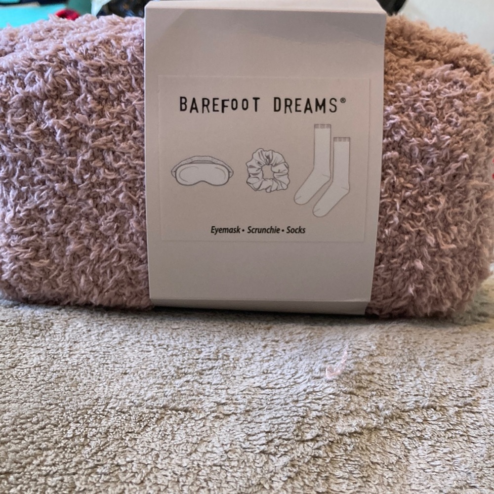 The grift set eye-mask, scrunchie,and socks in a bag